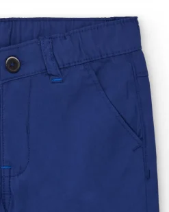 Bermuda para niño en azul con estampado de palmera