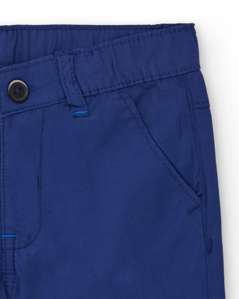 Bermuda para niño en azul con estampado de palmera