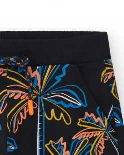 Bermuda pour garçon en noir avec imprimé tropical et taille élastique.