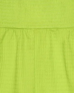 Combinaison pour fille en vert avec bretelles et détails multicolores.