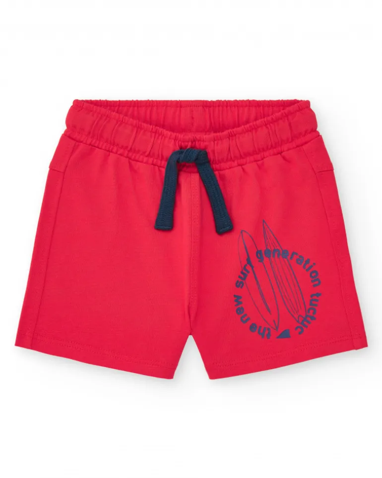 Ensemble pour garçon avec t-shirt bleu et bermuda rouge avec planches de surf
