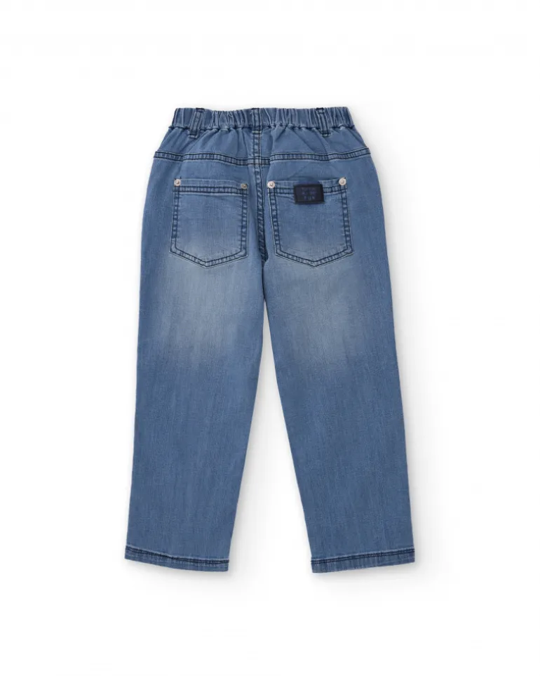 Pantalón vaquero para niño en azul con estampado de palmeras