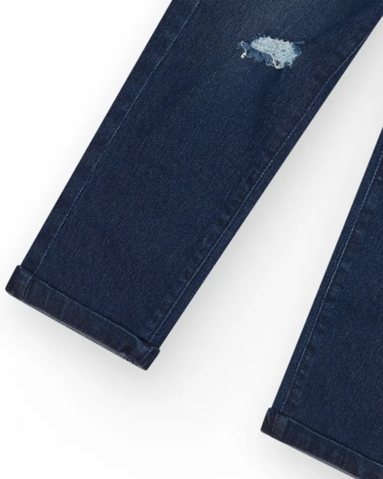 Pantalon en jean bleu foncé pour garçon avec effet usé.