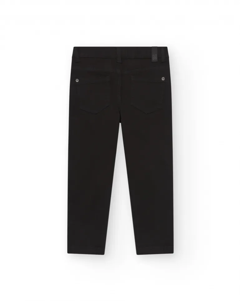 Pantalon noir pour garçon avec coupe ajustée et poches fonctionnelles.