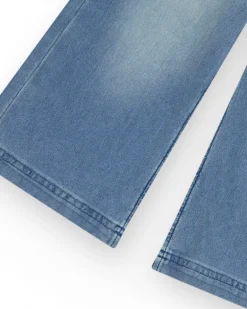 Pantalon pour fille en denim avec fermeture éclair et poches.