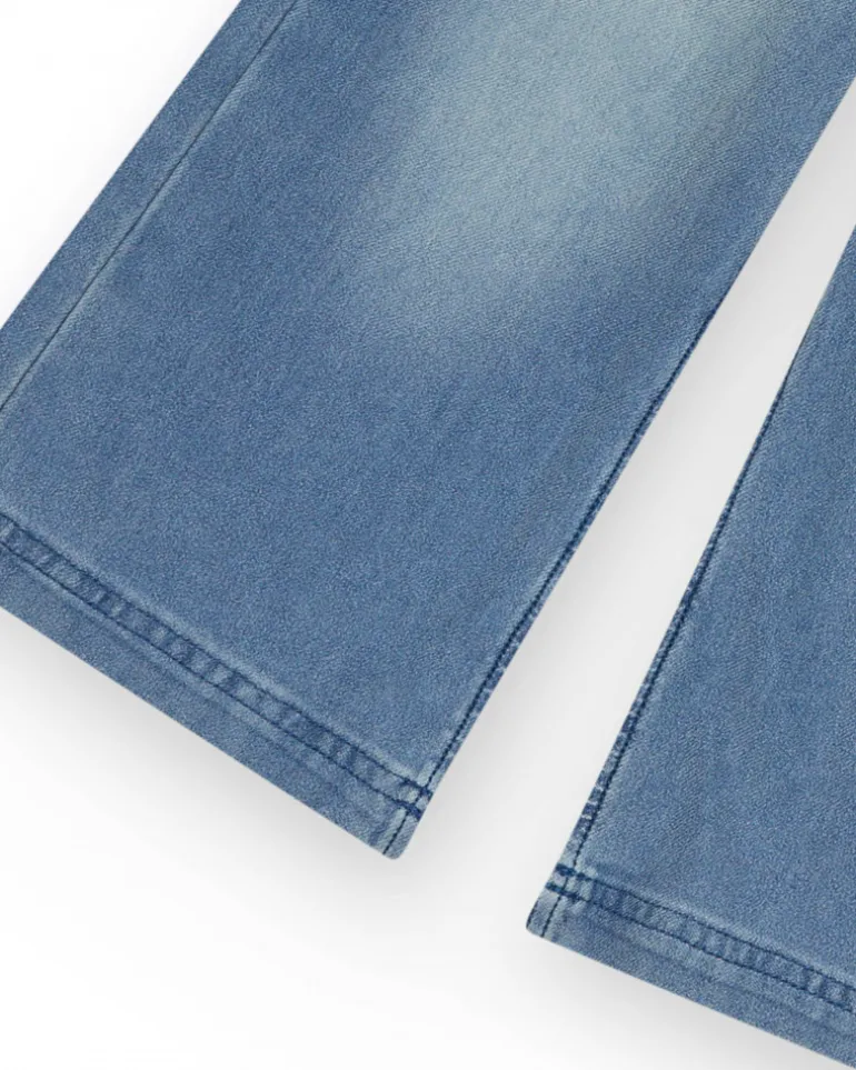 Pantalon pour fille en denim avec fermeture éclair et poches.