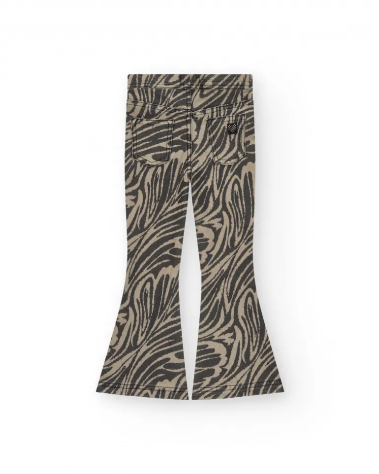 Pantalon pour fille en noir avec imprimé animal et clous à la taille.