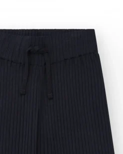 Pantalon pour fille en noir avec taille élastique et cordon de serrage.