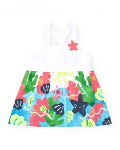 Robe blanche pour fille avec bretelles croisées et jupe fleurie