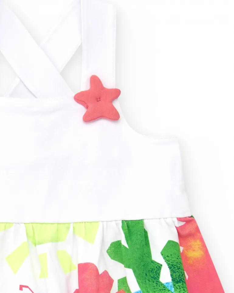 Robe blanche pour fille avec bretelles croisées et jupe fleurie