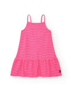 Robe pour fille en rose avec bretelles et volant.