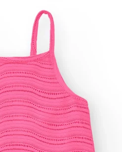 Robe pour fille en rose avec bretelles et volant.