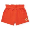 Short orange pour fille avec nœud et poches latérales