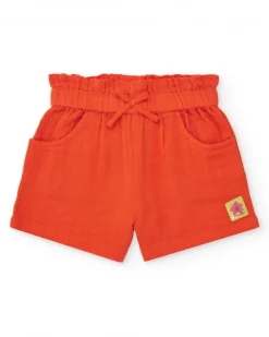 Short orange pour fille avec nœud et poches latérales