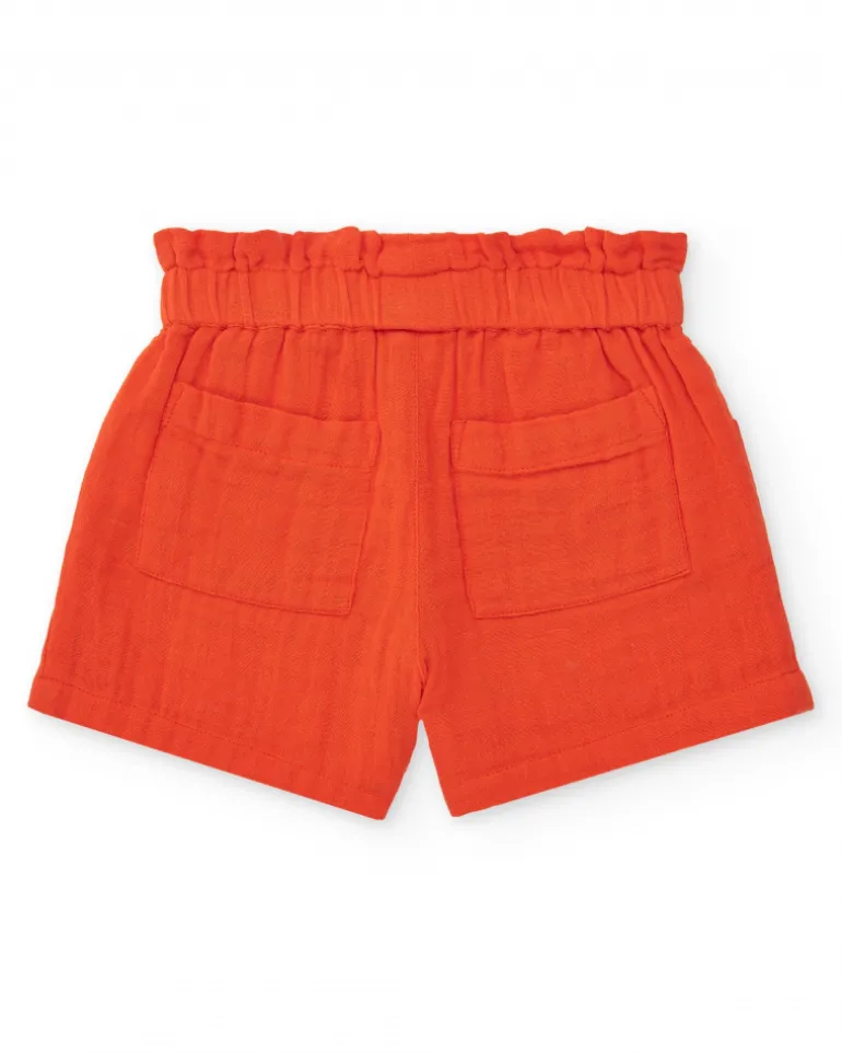 Short orange pour fille avec nœud et poches latérales