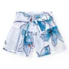 Short pour fille en blanc avec taille élastique et nœud décoratif.