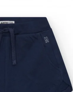 Short pour fille en bleu avec taille élastique et poches.