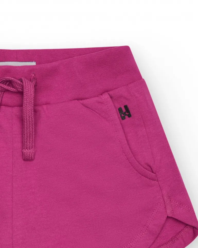Short pour fille en fuchsia avec taille élastique et poches.