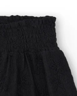 Short pour fille en noir avec taille élastique et imprimé floral.