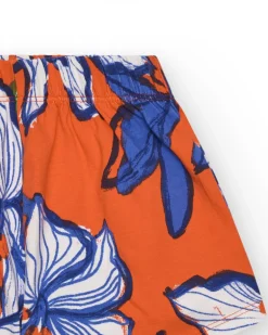Short pour fille en orange avec taille élastique et imprimé floral.