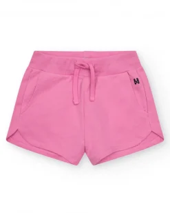 Short pour fille en rose fuchsia avec taille élastique et poches.
