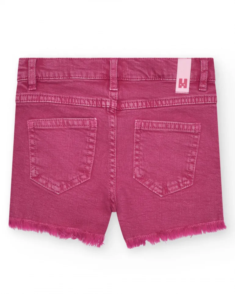Short pour fille en rose avec poches et fermeture à bouton.