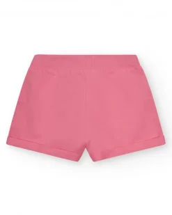 Short pour fille en rose avec taille élastique et poches.
