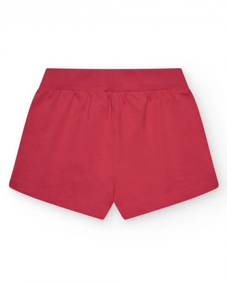 Short pour fille en rouge avec taille élastique et poches.