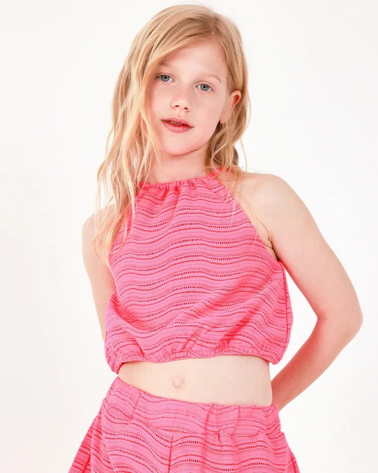 Top pour fille en rose avec bretelles et taille élastique.