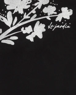 T-shirt à manches courtes pour fille en noir avec manches bouffantes.