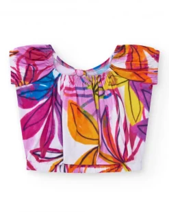 T-shirt pour fille en blanc avec imprimé tropical et nœud dans le dos.