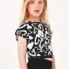 T-shirt pour fille en noir, à manches courtes, avec détails brillants.