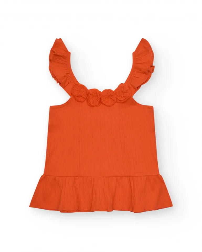 T-shirt pour fille en orange avec volants et broderies.