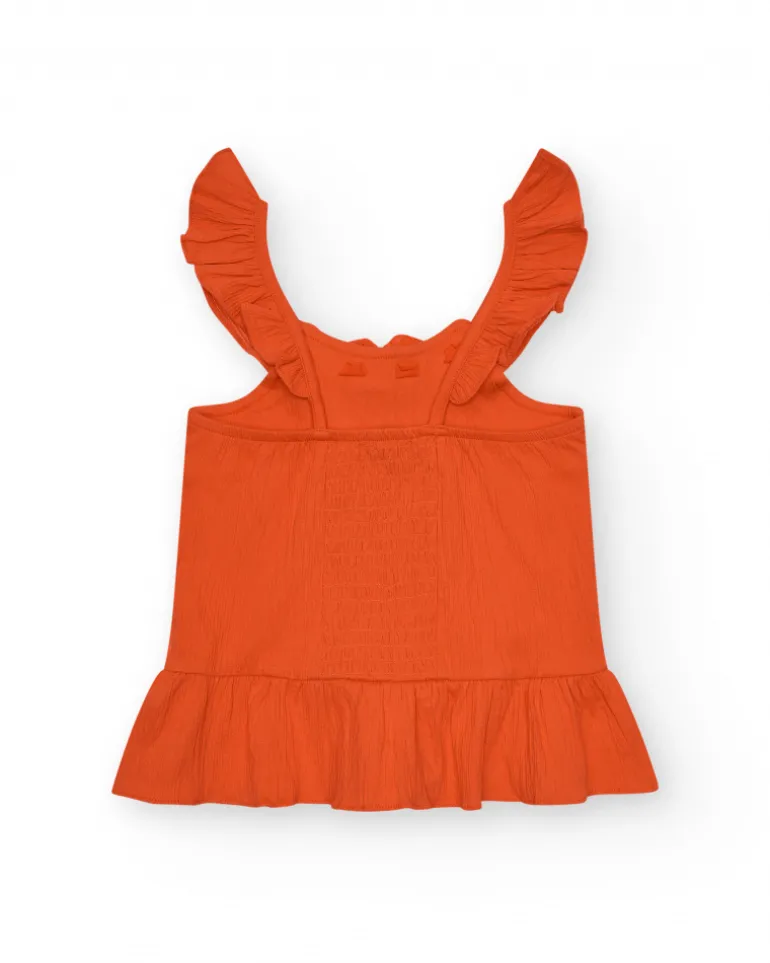 T-shirt pour fille en orange avec volants et broderies.